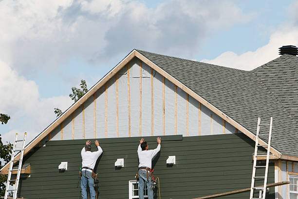 Professional Siding technician working in New London, OH